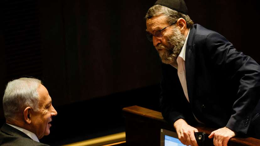 FILE PHOTO: Moshe Gafni, head of United Torah Judaism party, chats with Israeli designate Prime Minister Benjamin Netanyahu during a session at the plenum at the Knesset, Israel's parliament in Jerusalem