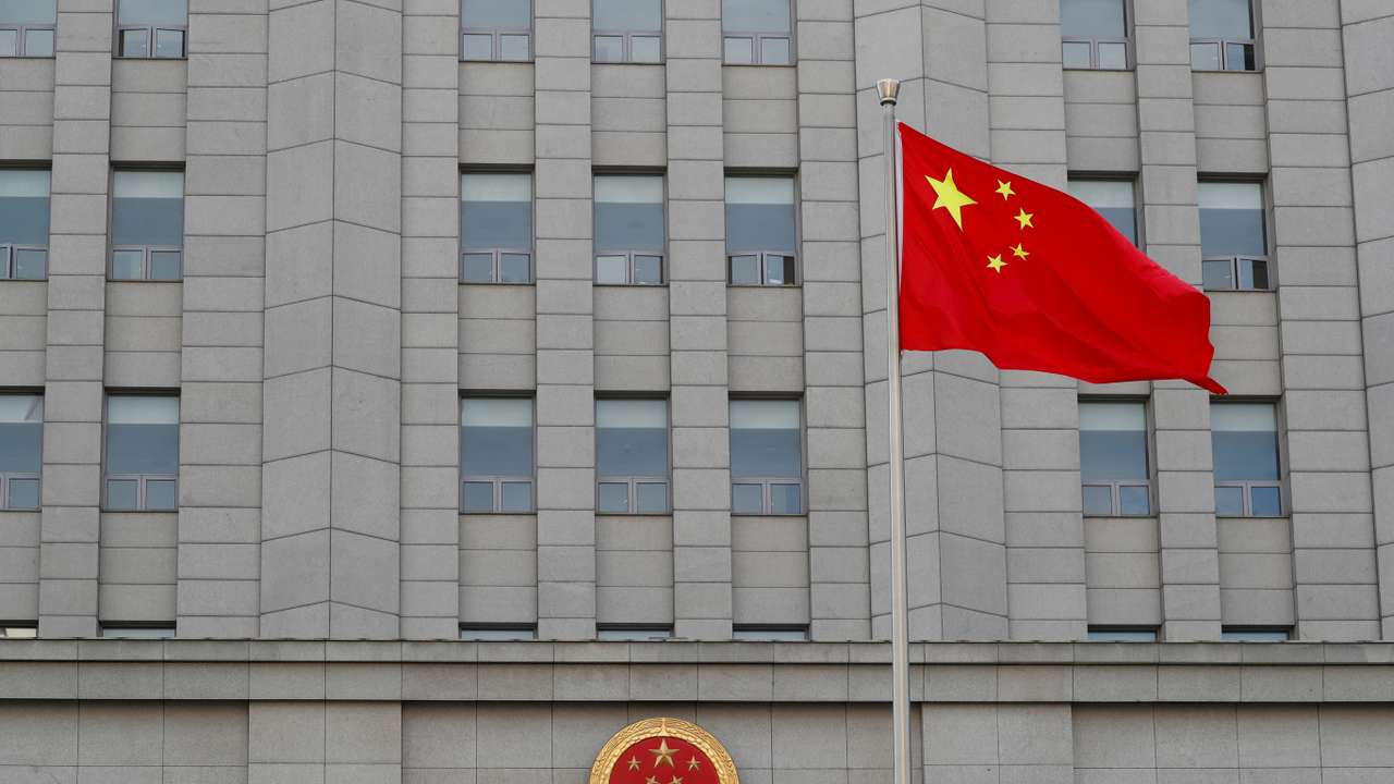 A Chinese national flag waves outside Beijing No. 2 Intermediate People's Court where Australian writer Yang Hengjun is expected to face trial on espionage charges, in Beijing