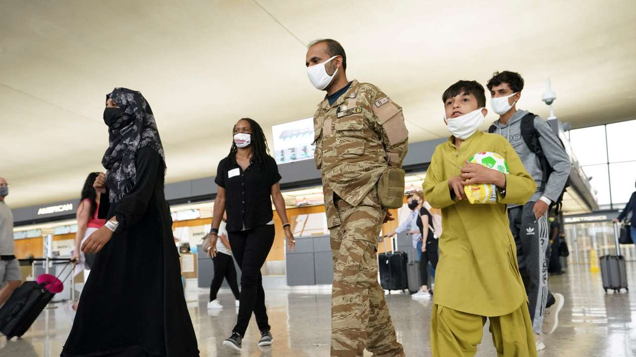 FILE PHOTO: Afghan refugees arrive at Dulles Airport in Virginia