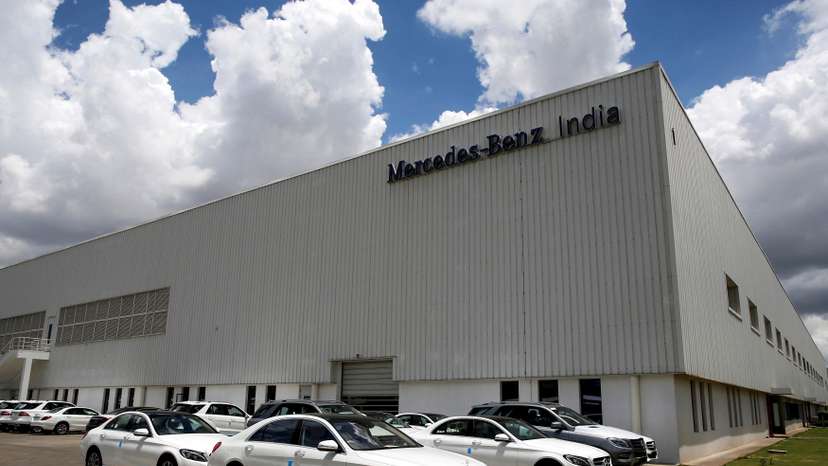FILE PHOTO: Different models of Mercedes-Benz cars are parked at the company's vehicle assembly plant in Chakan