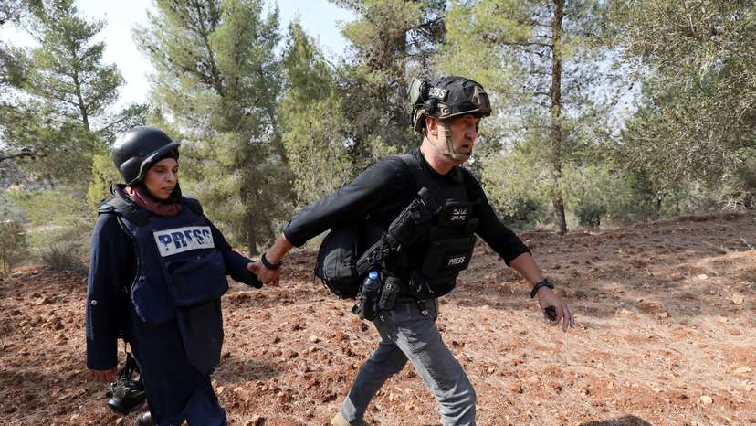 Israeli settlers attack Palestinians, journalists at West Bank olive harvest, witnesses say