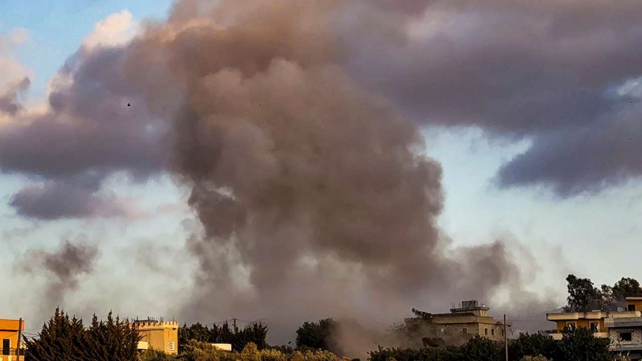 Smoke billows over Kfar Tebnit after an Israeli strike near Lebanon’s border with Israel