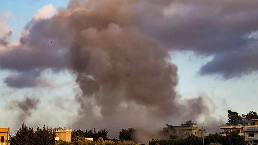 Smoke billows over Kfar Tebnit after an Israeli strike near Lebanon’s border with Israel