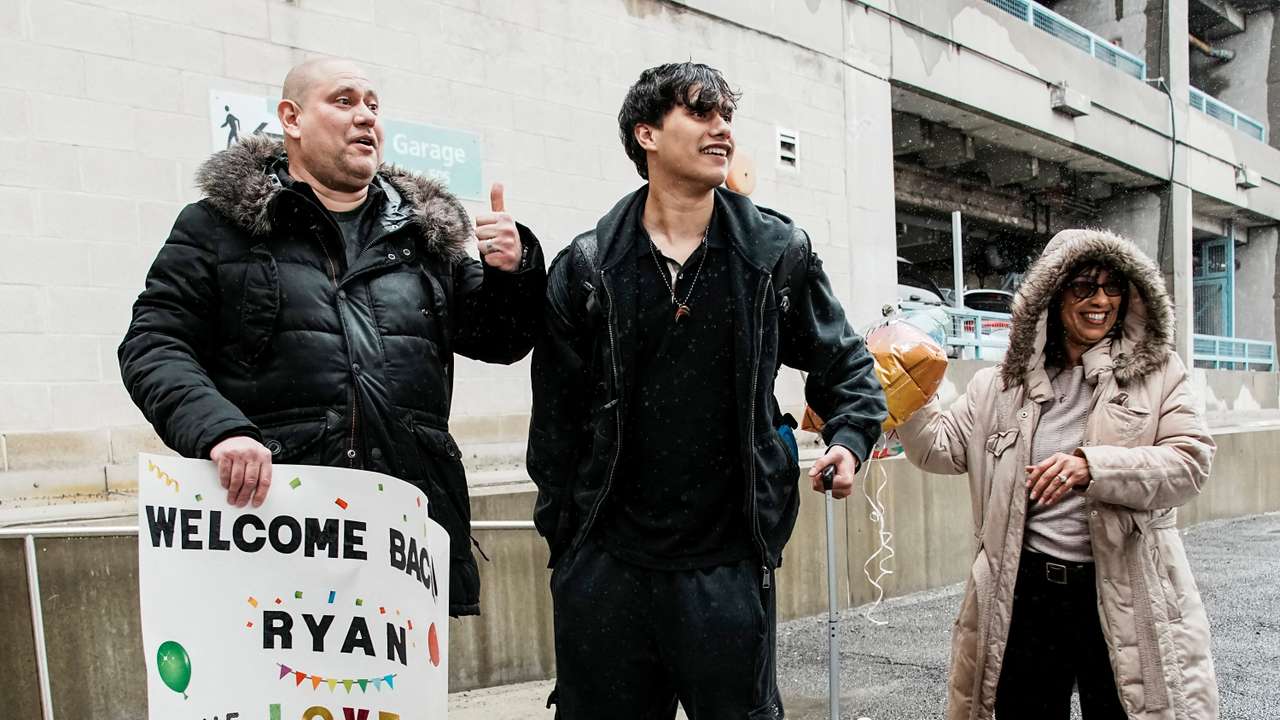 People arrive via U.S. government chartered flight at John F. Kennedy (JFK) International Airport in New York
