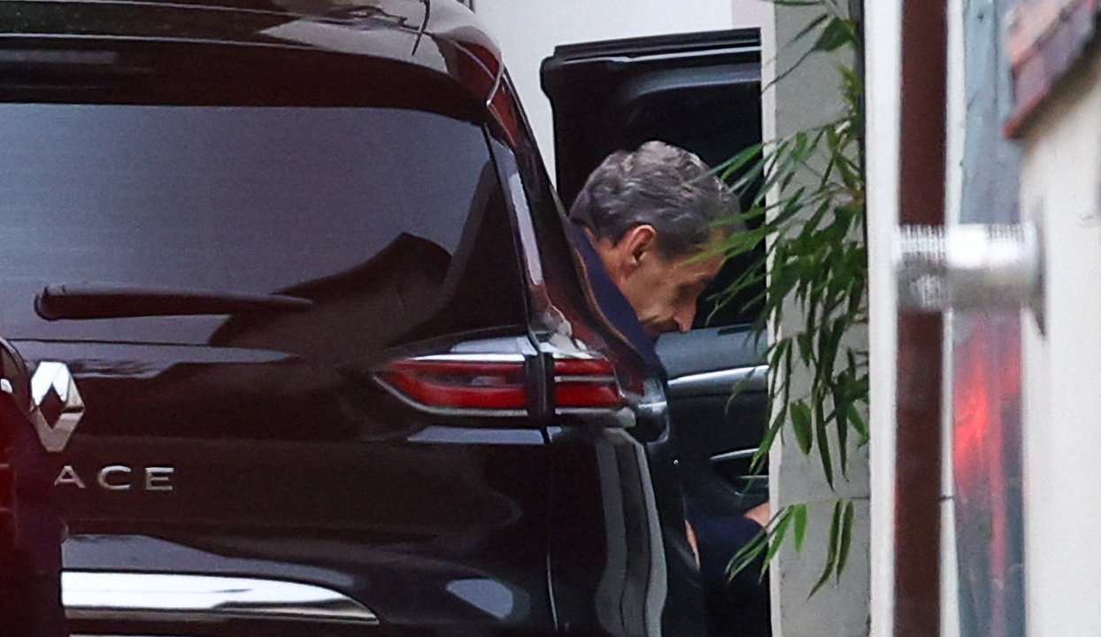 Former French President Sarkozy arrives at his house after being released from jail, in Paris