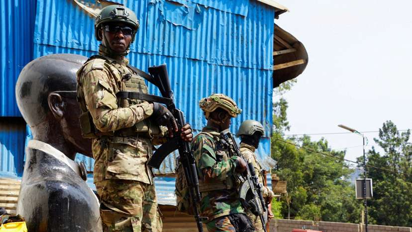 FILE PHOTO: Members of the M23 rebel group stand guard