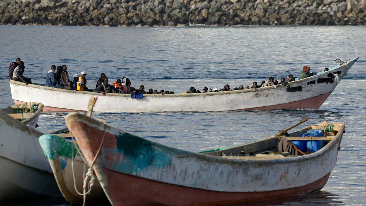 FILE PHOTO: Migrants arrive at the Port of Arguineguin, on the island of Gran Canaria