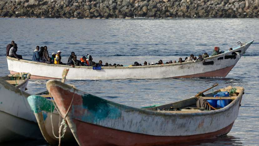 FILE PHOTO: Migrants arrive at the Port of Arguineguin, on the island of Gran Canaria