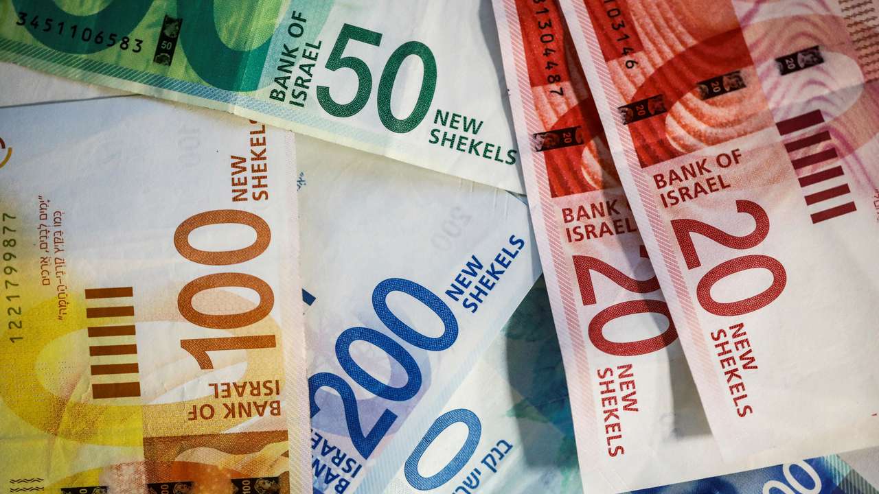 New Israeli Shekel banknotes are seen in this picture illustration