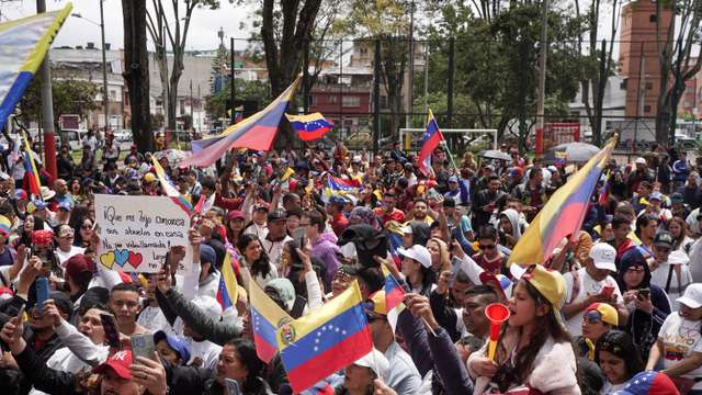 Venezuelans cast their vote to elect president, in Bogota