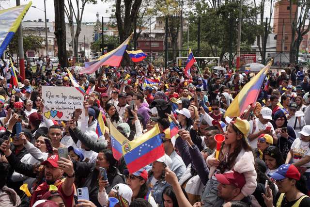 Venezuelans cast their vote to elect president, in Bogota