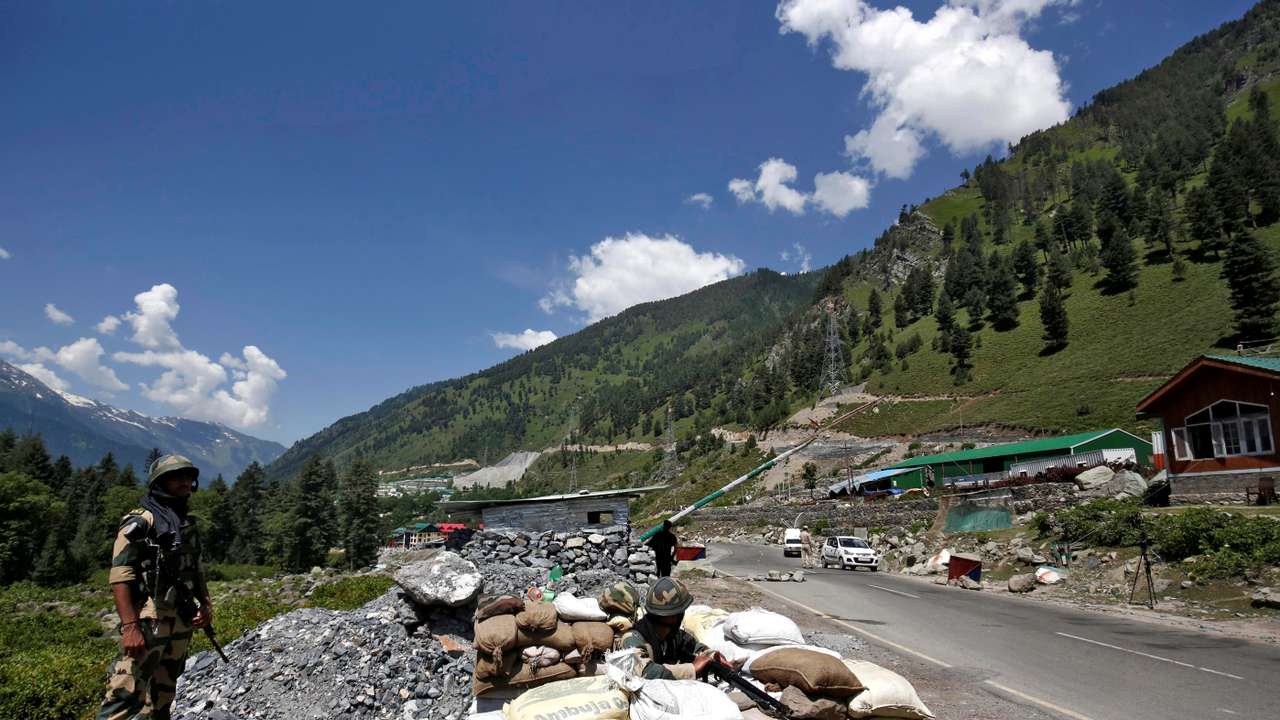 India's BSF soldiers stand guard at a checkpoint along a highway leading to Ladakh, at Gagangeer