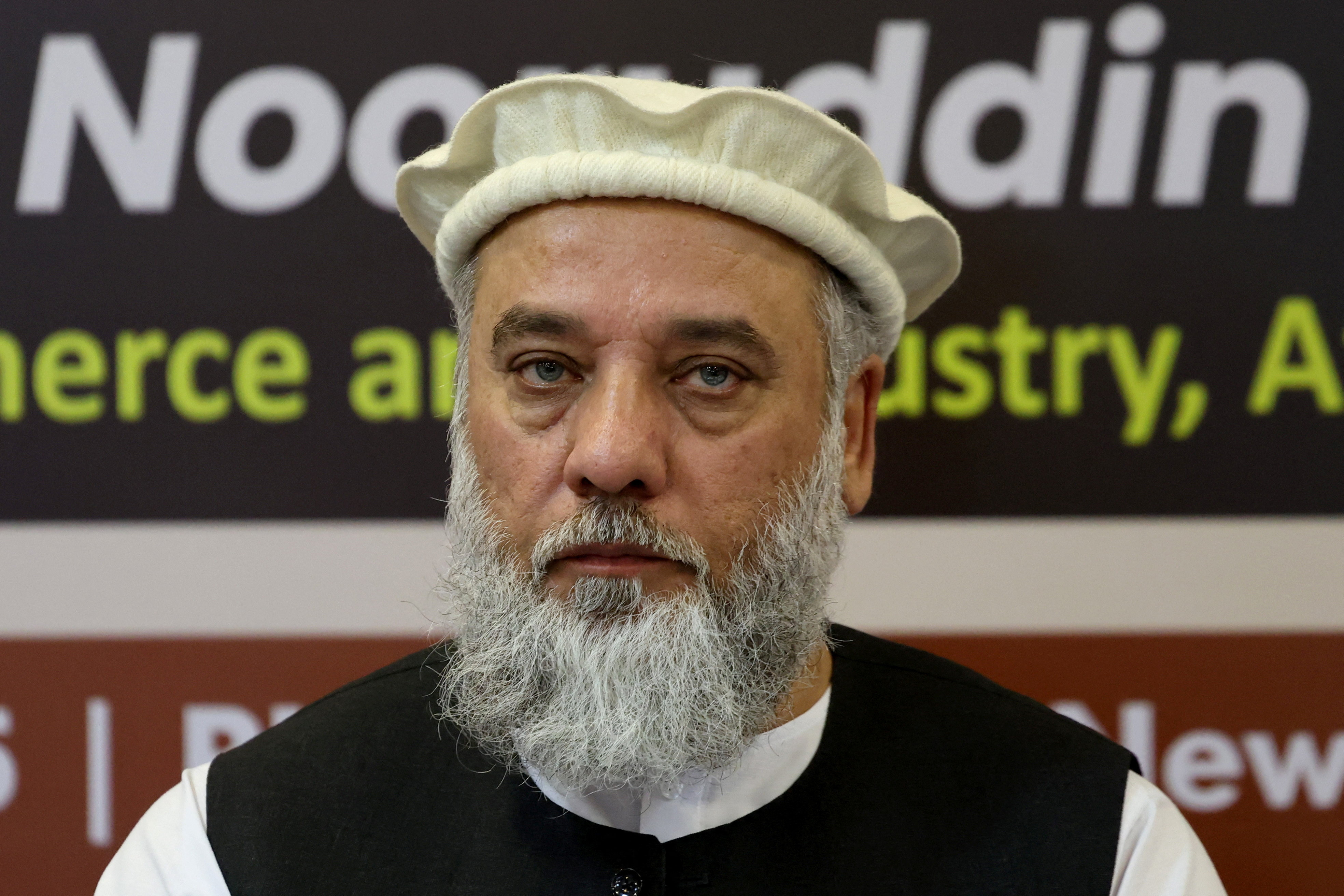 Afghanistan's Taliban Trade Minister Nooruddin Azizi addresses a delegation