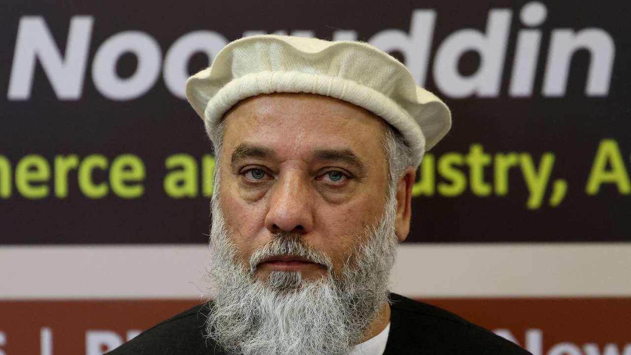 Afghanistan's Taliban Trade Minister Nooruddin Azizi addresses a delegation