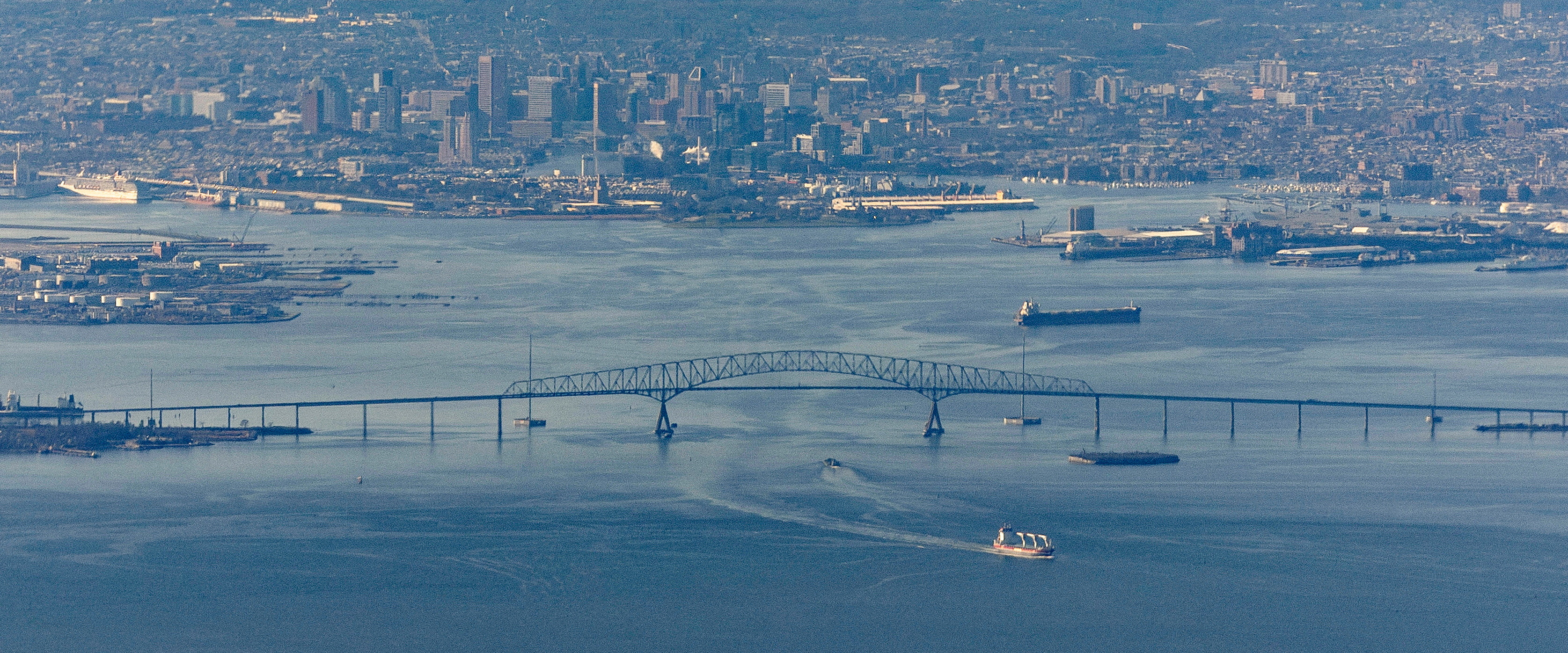 A ship moves under the Francis Scott Key Bridge near Baltimore, on the day U.S. President Joe Biden travels to Washington