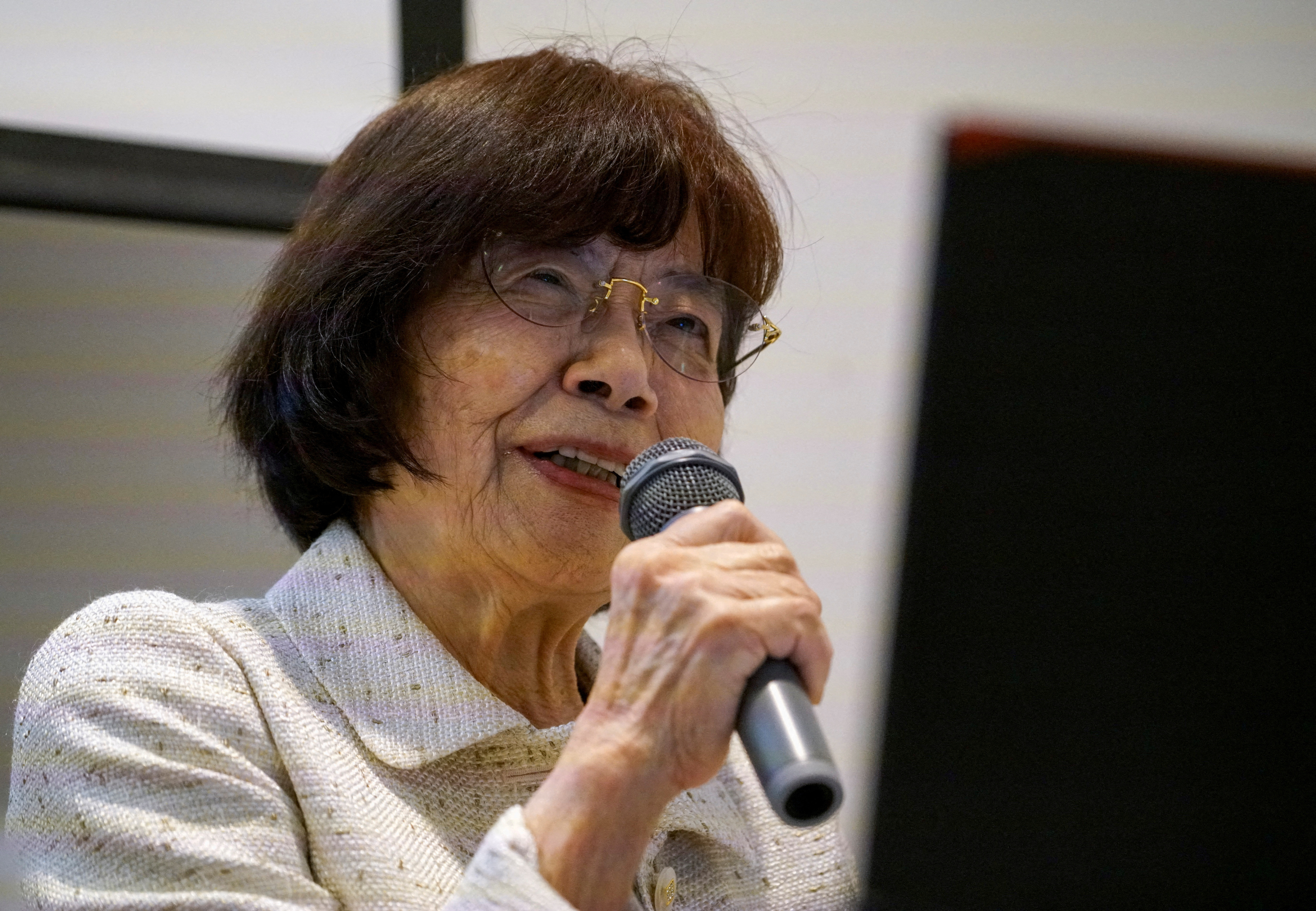 FILE PHOTO: Atomic bomb survivor Teruko Yahata speaks to foreign visitors in Hiroshima
