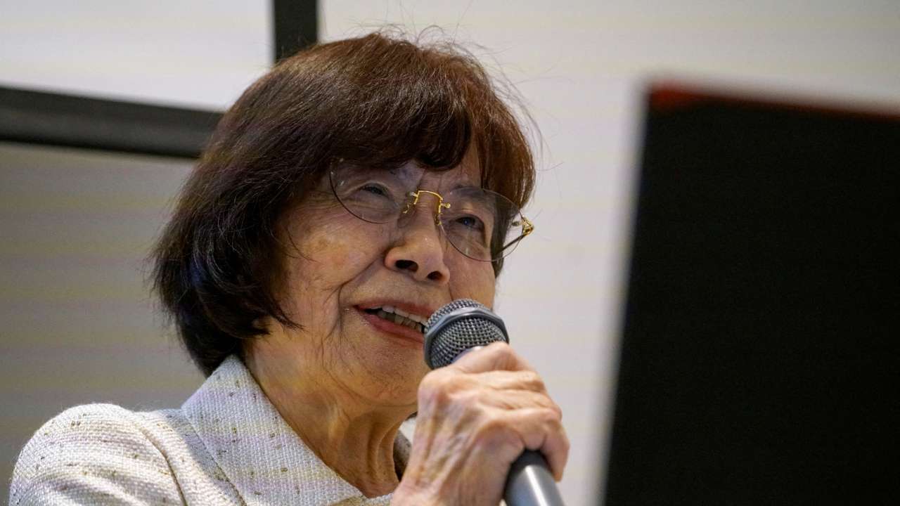 FILE PHOTO: Atomic bomb survivor Teruko Yahata speaks to foreign visitors in Hiroshima