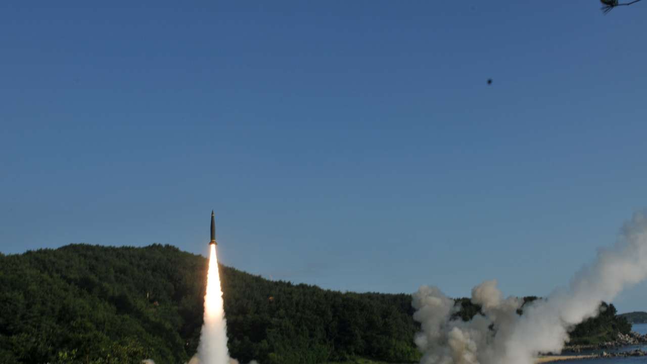FILE PHOTO: Handout of United States and South Korean troops utilizing the Army Tactical Missile System (ATACMS) and South Korea's Hyunmoo Missile II, fire missiles into the waters of the East Sea, off South Korea