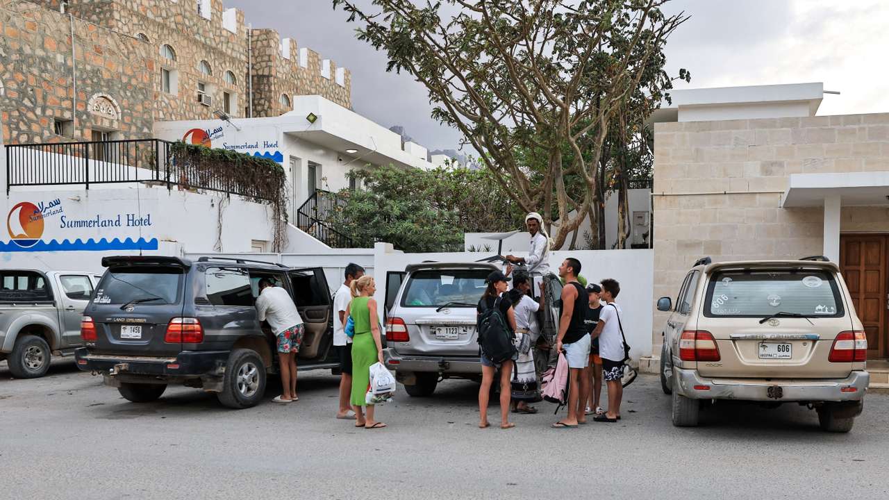 Tourists stand outside a hotel in the Socotra Island, Yemen