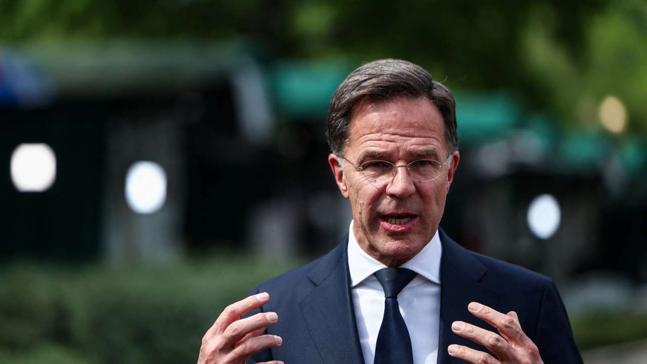 NATO Secretary General Mark Rutte gestures in front of the White House