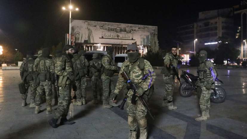Syrian opposition fighters gather at Saadallah al-Jabiri Square, after rebels opposed to President Bashar al-Assad said they had reached the heart of Aleppo