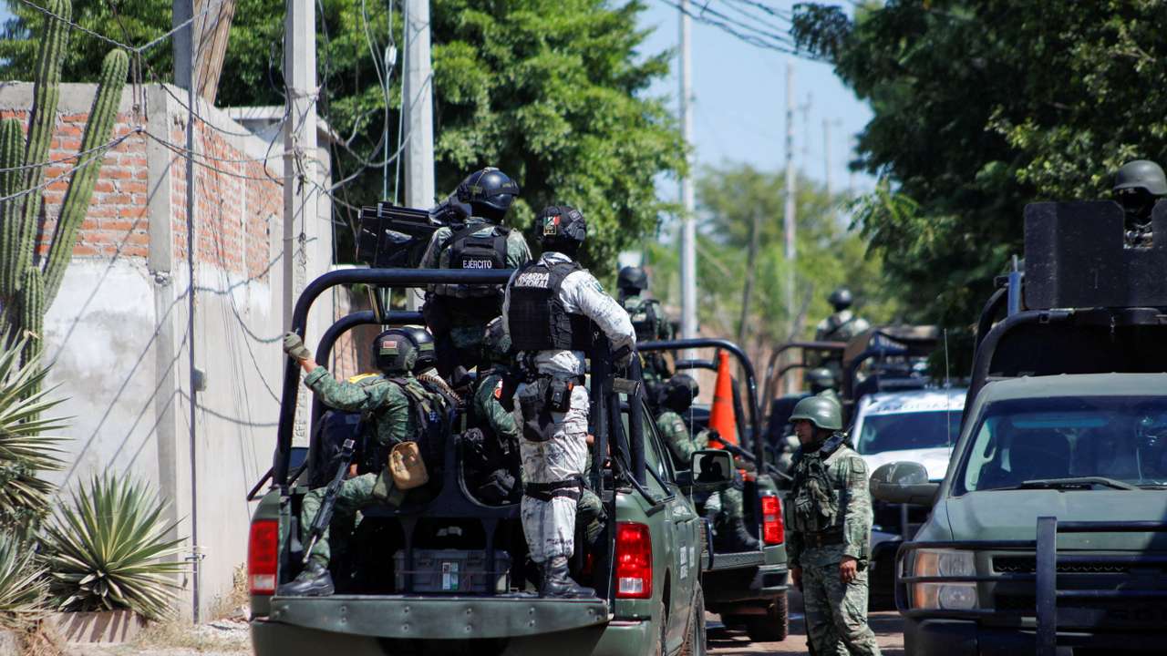 FILE PHOTO: Federal forces guard the perimeter of a scene following a shootout, in Culiacan