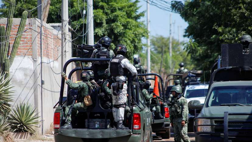 FILE PHOTO: Federal forces guard the perimeter of a scene following a shootout, in Culiacan