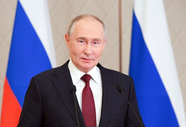 Russian President Putin attends a press conference in Astana