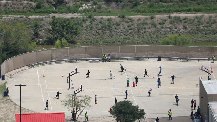 FILE PHOTO: Migrant boys spend time in a recreation area outside Casa Padre, an immigrant shelter for unaccompanied minors, in Brownsville