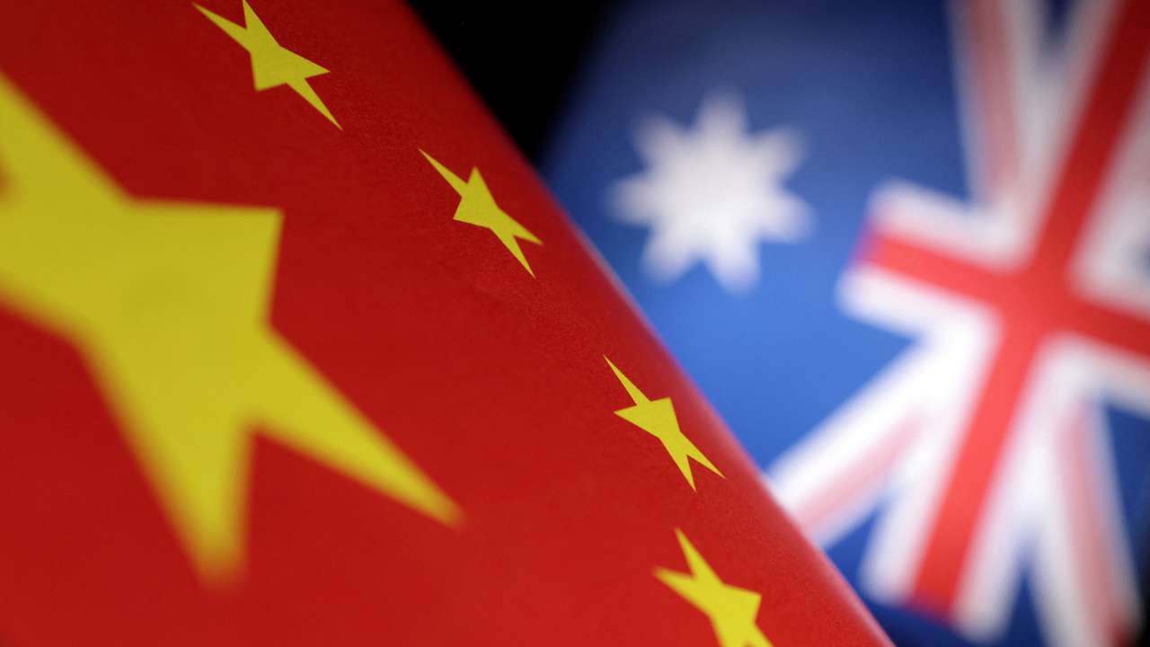 Illustration shows printed Chinese and Australian flags