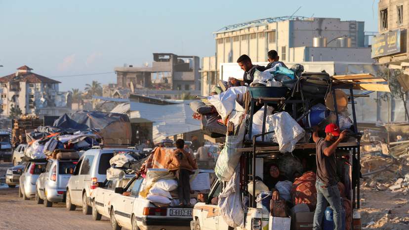 Displaced Palestinians who fled Rafah, ahead of a threatened Israeli assault, travel in Khan Younis