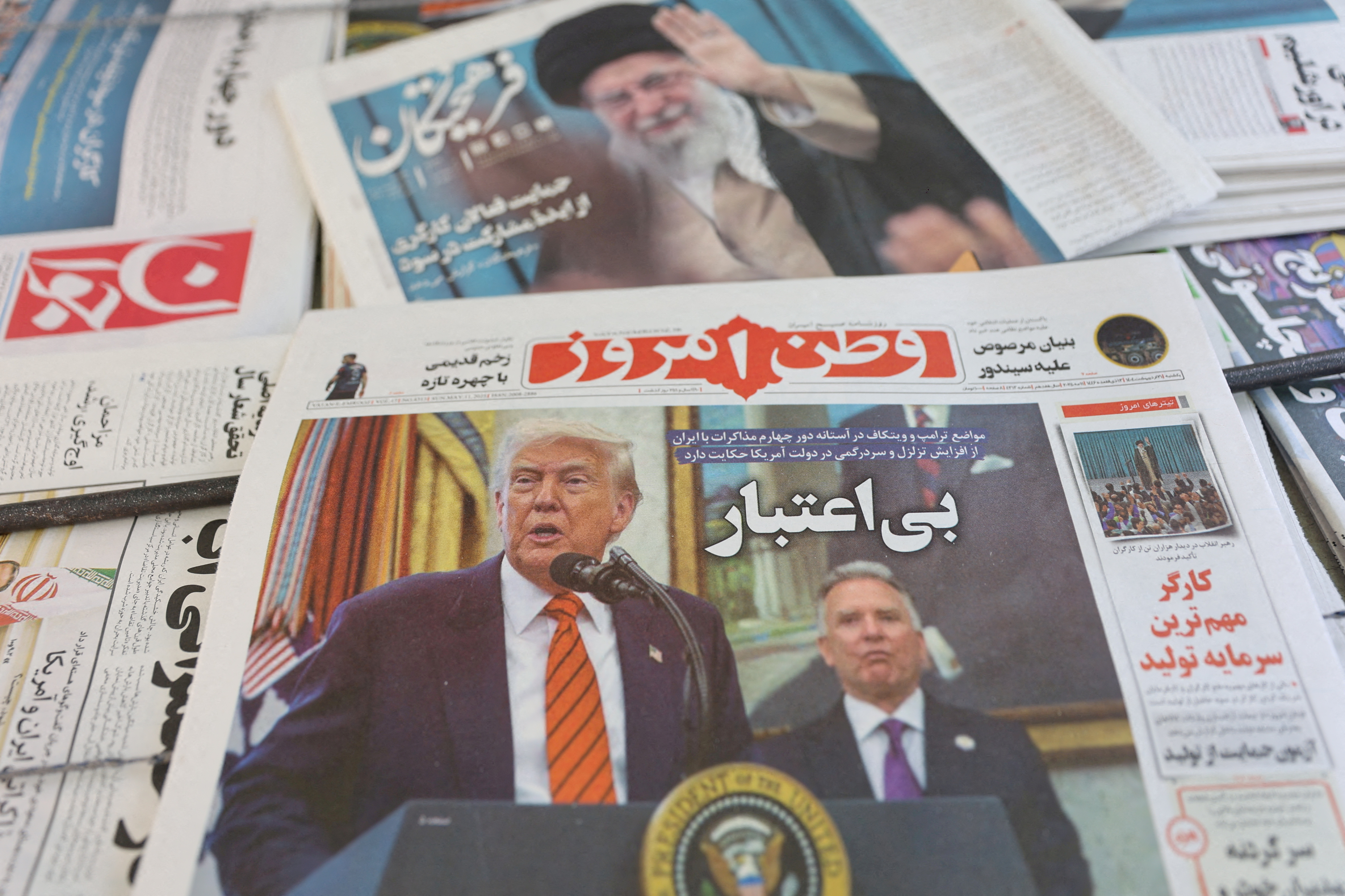 FILE PHOTO: An Iranian newspaper with a cover photo of U.S. President Donald Trump and U.S. Middle East envoy Steve Witkoff, is seen in Tehran