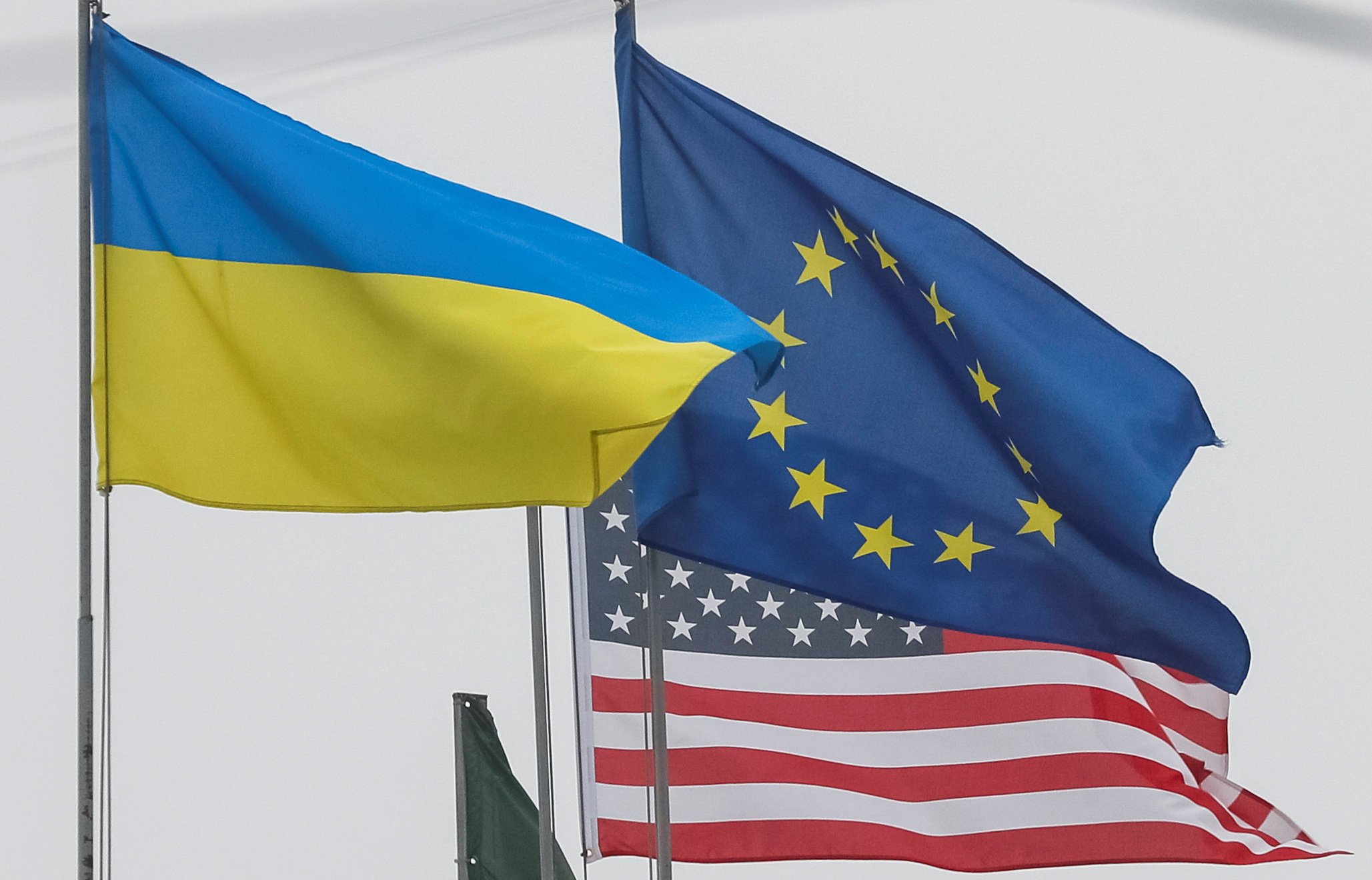 State flags of Ukraine, European Union and U.S. flutter in central Kyiv
