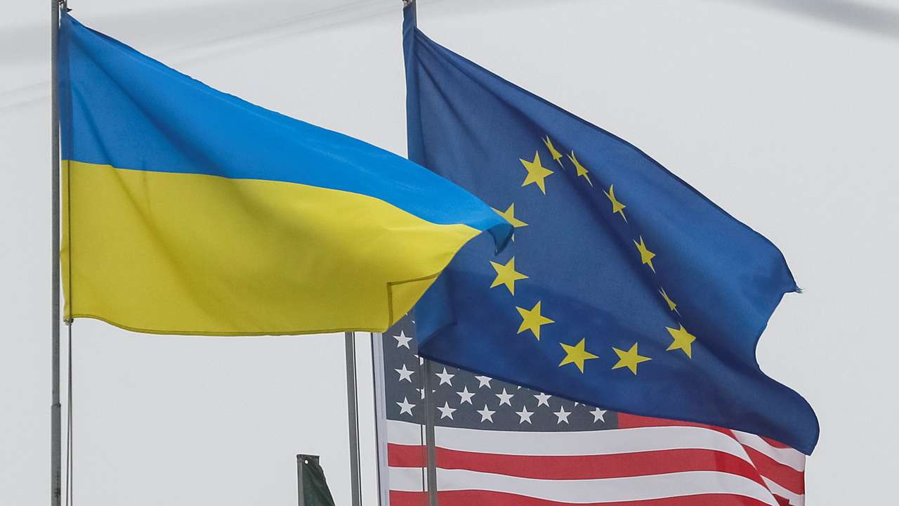 State flags of Ukraine, European Union and U.S. flutter in central Kyiv