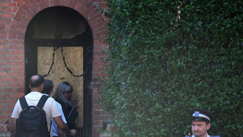 Police officers stand outside Britain's Prime Minister Starmer's home, after it was damaged by fire in suspected arson attack in north London