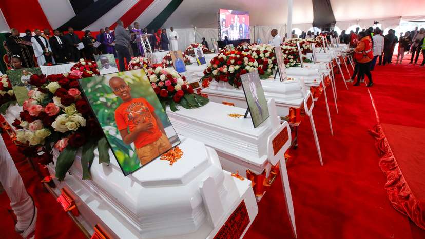Coffins are arranged before a memorial service for the pupils who died after a fatal fire at the Hillside Endarasha Academy within Kieni in Nyeri County