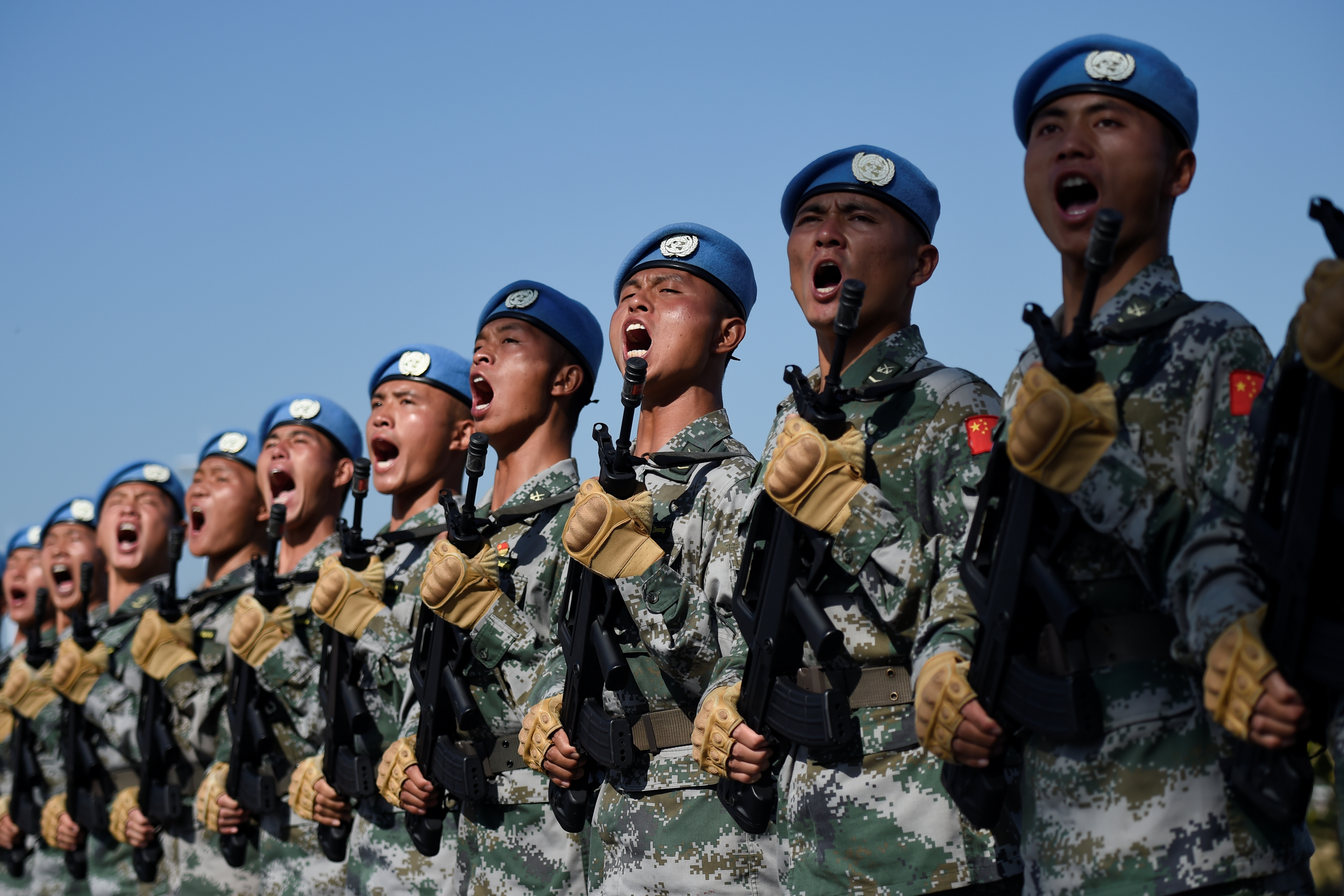 Chinese troops take part in marching drills ahead of an October 1 military parade to celebrate the 70th anniversary of the founding of the People's Republic of China at a camp on the outskirts of Beijing