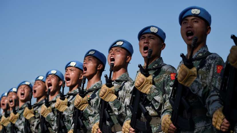 Chinese troops take part in marching drills ahead of an October 1 military parade to celebrate the 70th anniversary of the founding of the People's Republic of China at a camp on the outskirts of Beijing
