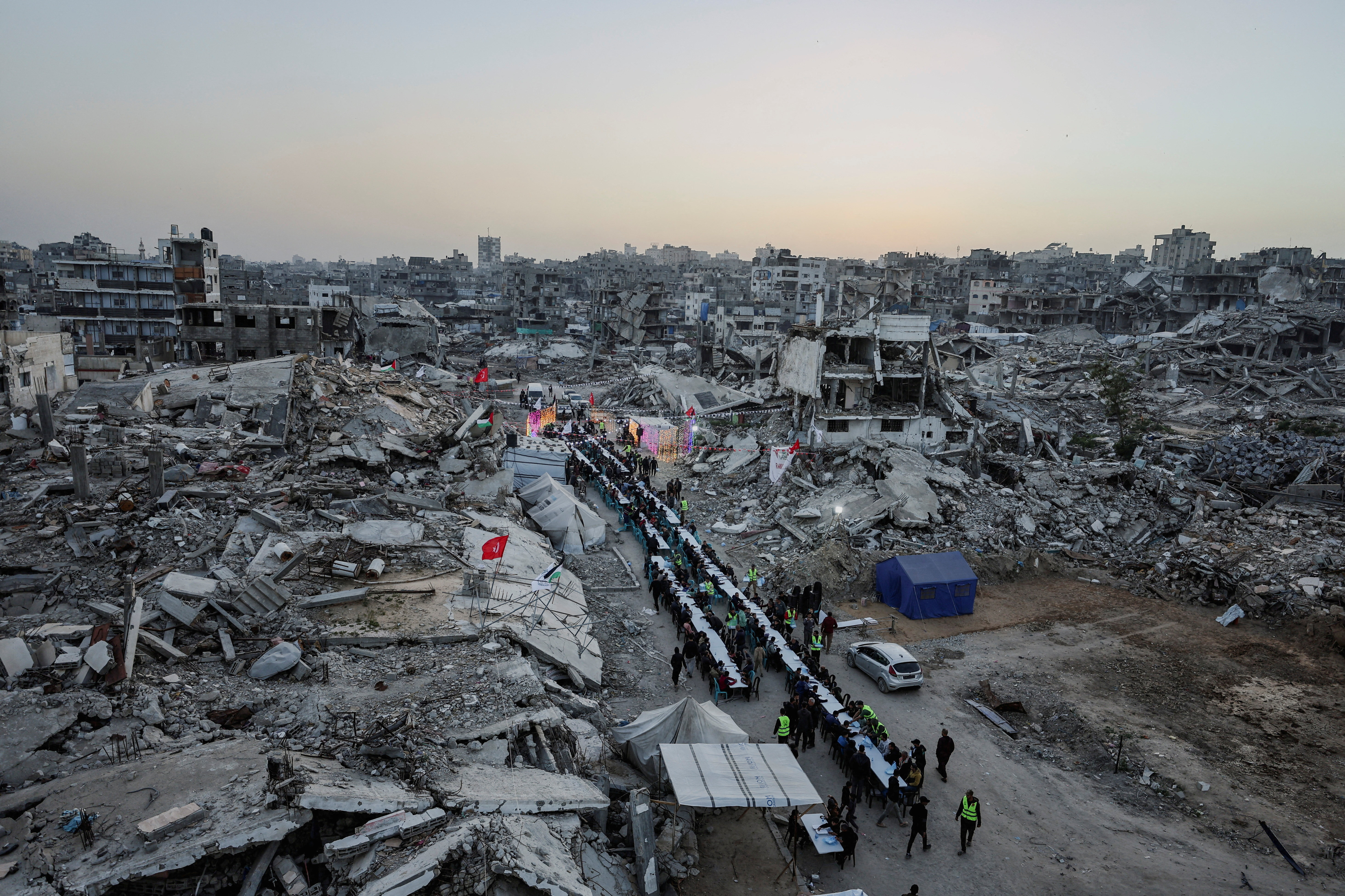 FILE PHOTO: Palestinians gather to break their fast by eating Iftar meals on the first day of the holy month of Ramadan, in Gaza City