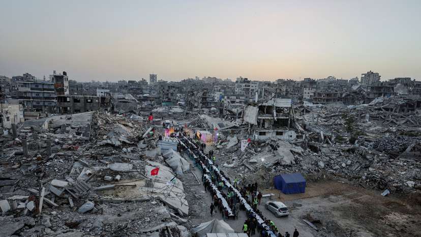 FILE PHOTO: Palestinians gather to break their fast by eating Iftar meals on the first day of the holy month of Ramadan, in Gaza City