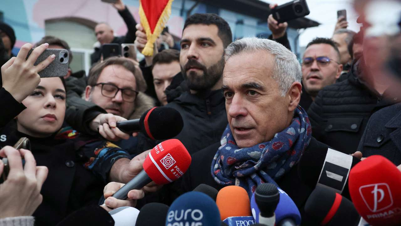 Romanian independent far-right presidential candidate Calin Georgescu gives a statement outside his voting station