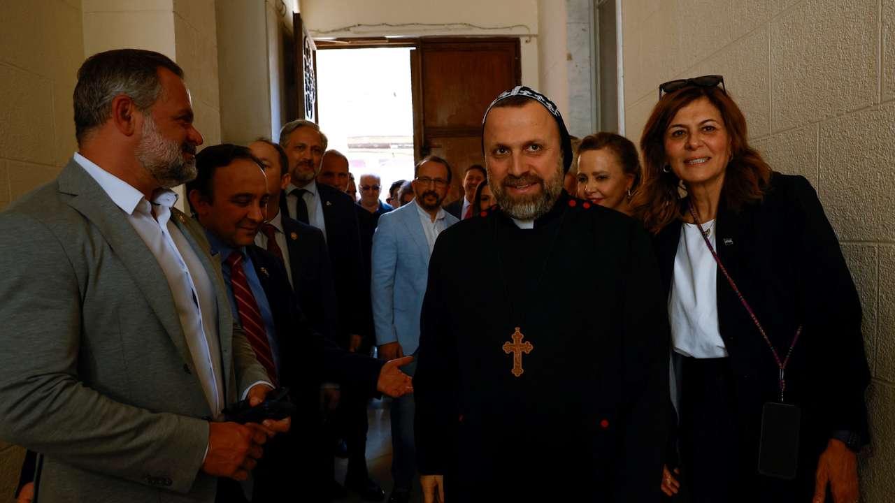 U.S Congressman Cory Mills stands next to a member of the clergy, on the day he meets Syriac Orthodox Patriarch Mor Ignatius Aphrem (not pictured), in Damascus