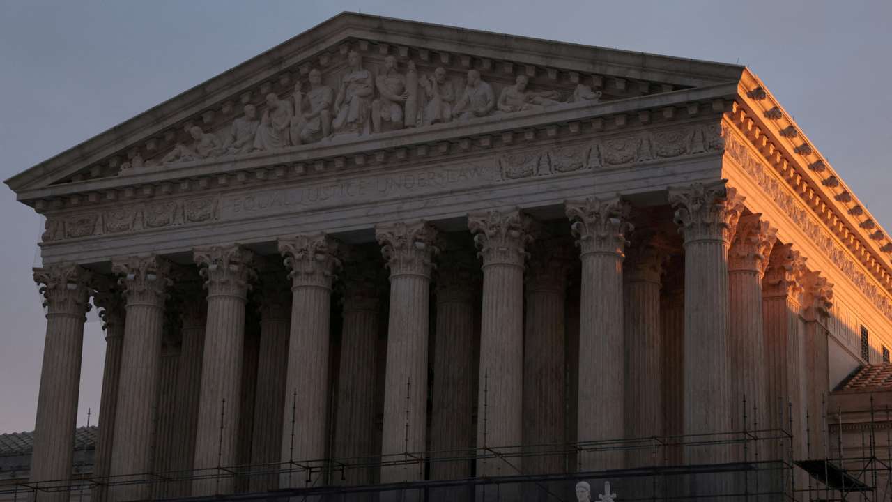 FILE PHOTO: Light from the rising sun hits the U.S. Supreme Court building at the start of the day in Washington, D.C.
