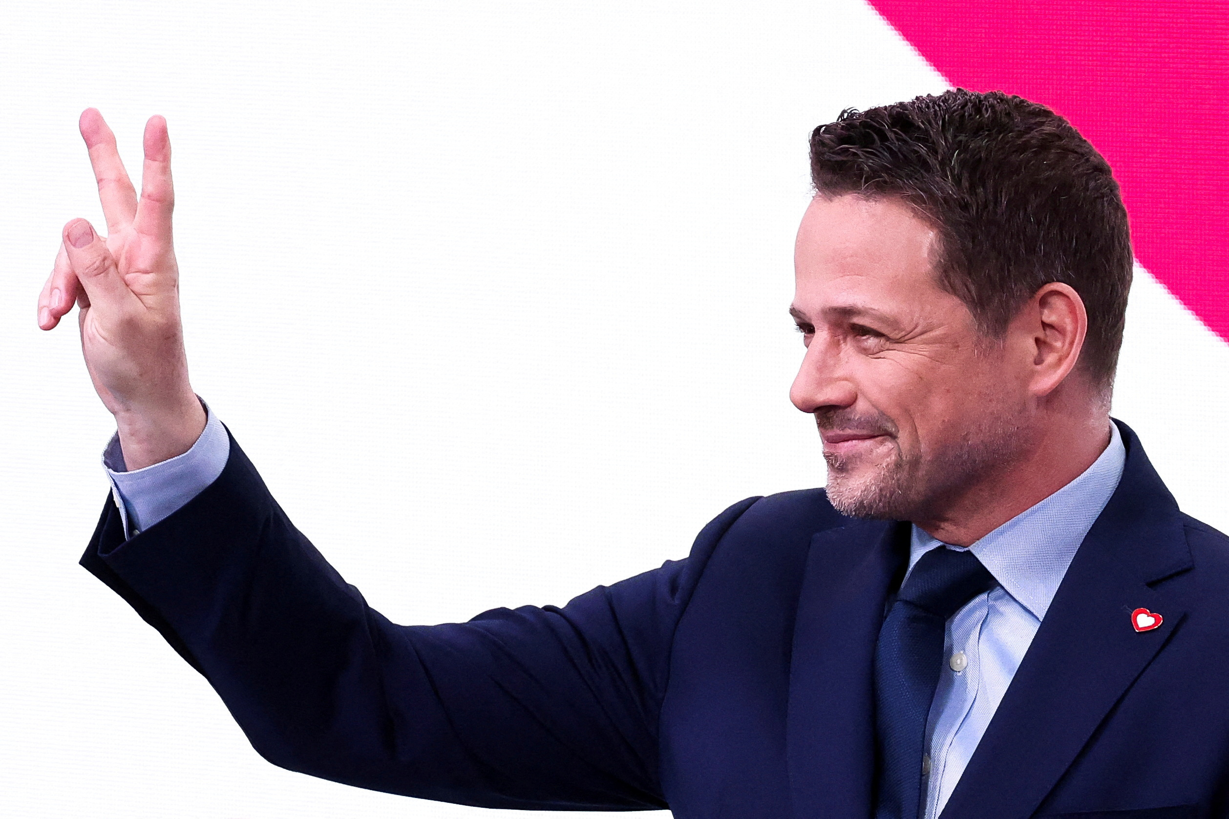 Warsaw Mayor Rafal Trzaskowski gestures following the results of local elections exit polls