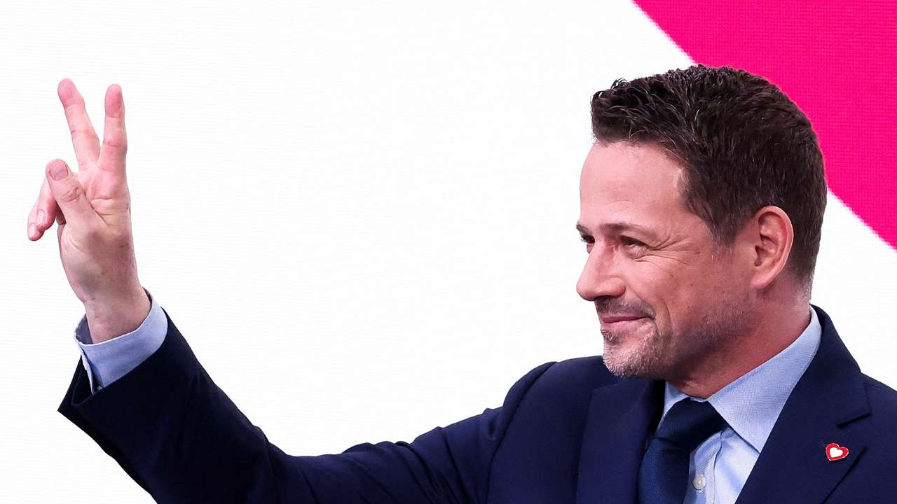 Warsaw Mayor Rafal Trzaskowski gestures following the results of local elections exit polls