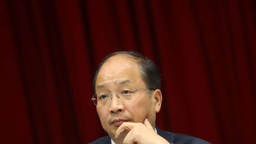 Yi Huiman, chairman of China Securities Regulatory Commission, attends a meeting of Fujian delegation on the sidelines of the National People's Congress (NPC), at the Great Hall of the People in Beijing