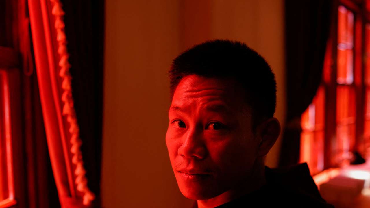 Fu Tong poses for a photo at the Hong Kong human rights exhibition in Taipei