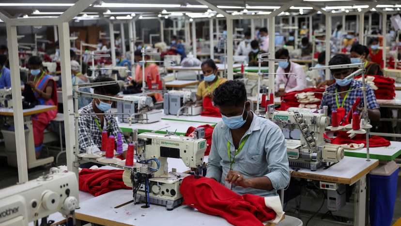 Employees work at a garment factory in Tiruppur