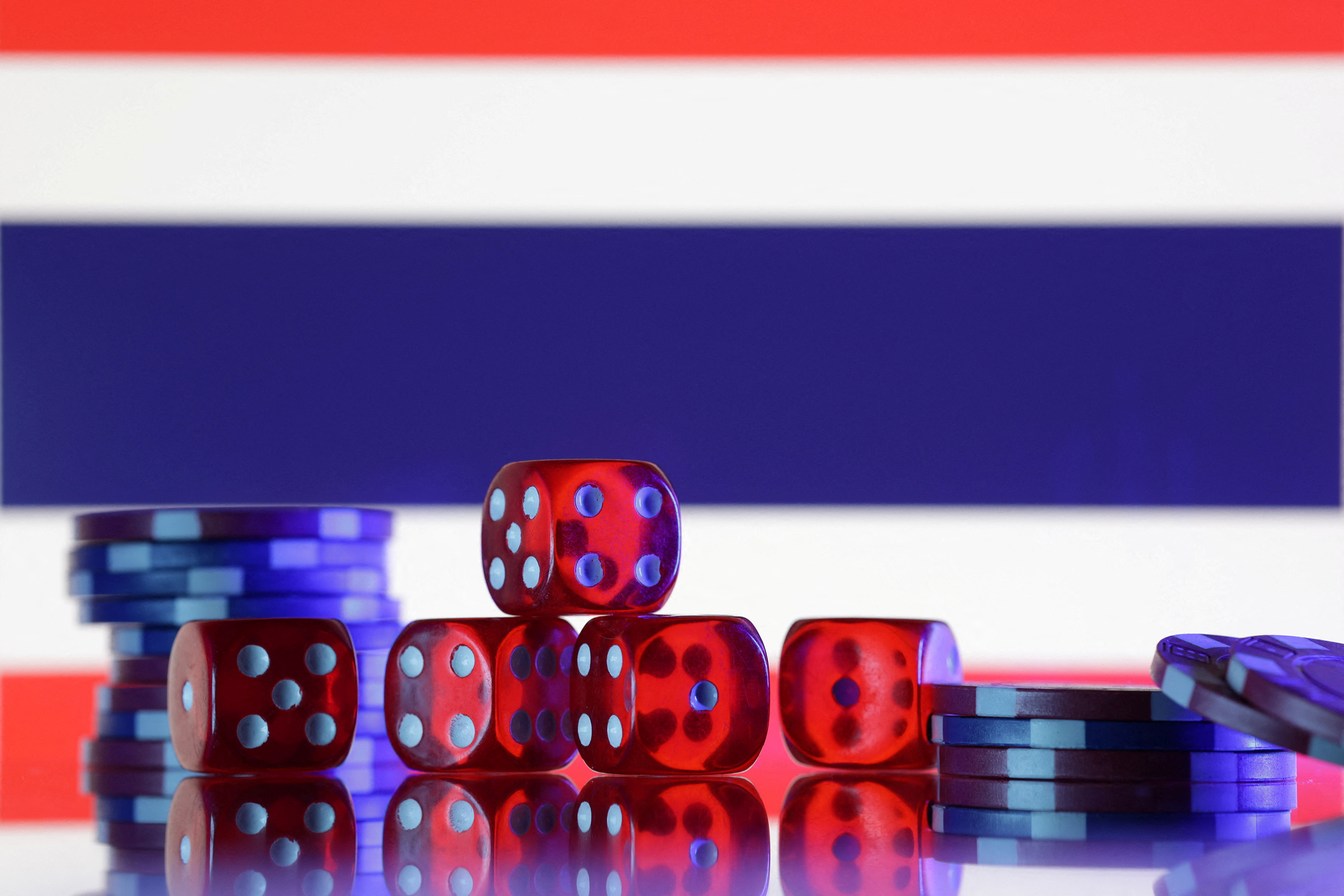 Illustration shows gambling cubes, Thailand flag