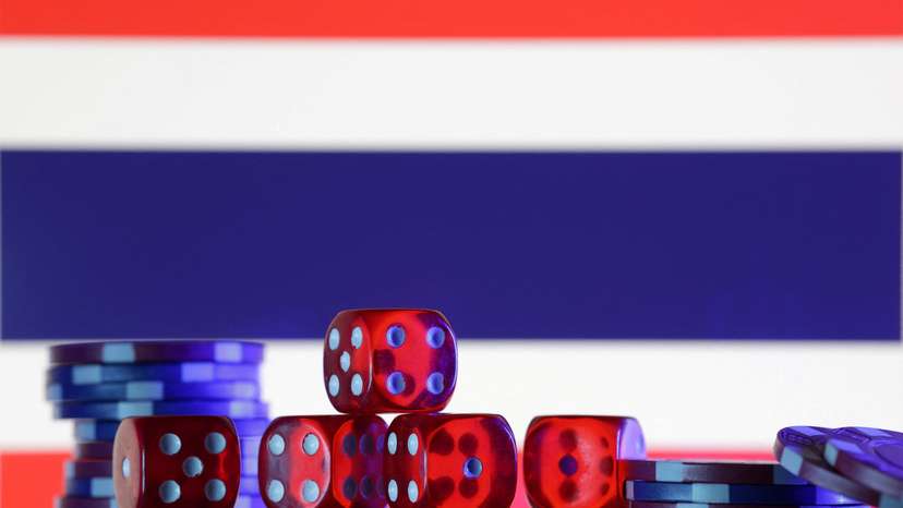 Illustration shows gambling cubes, Thailand flag